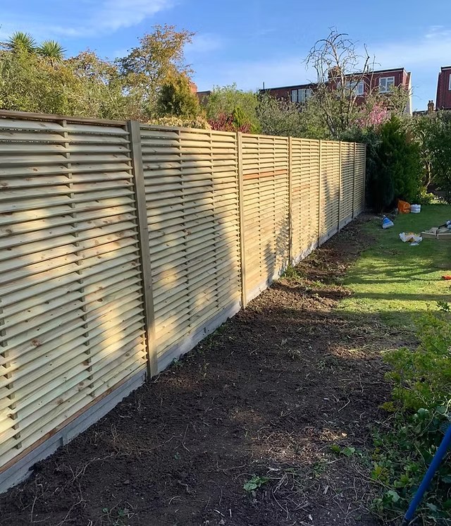 Feather edge close board fencing installed