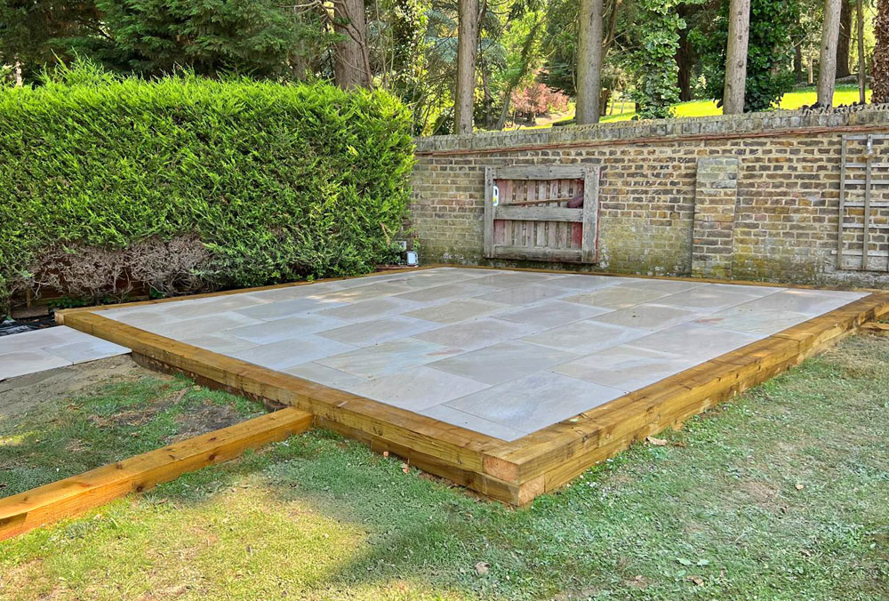 Patio slabs with timber sleeper edging